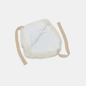 Faux fur trim trapper hat in ivory with tan straps and white lining.