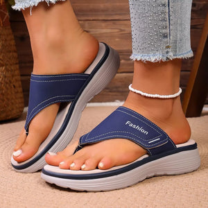 Blue toe post platform sandals with white stitching and "Fashion" text detail.