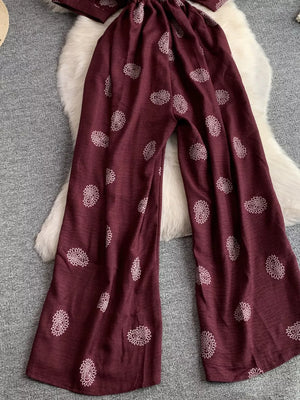 Burgundy paisley print drawstring jumpsuit with wide legs