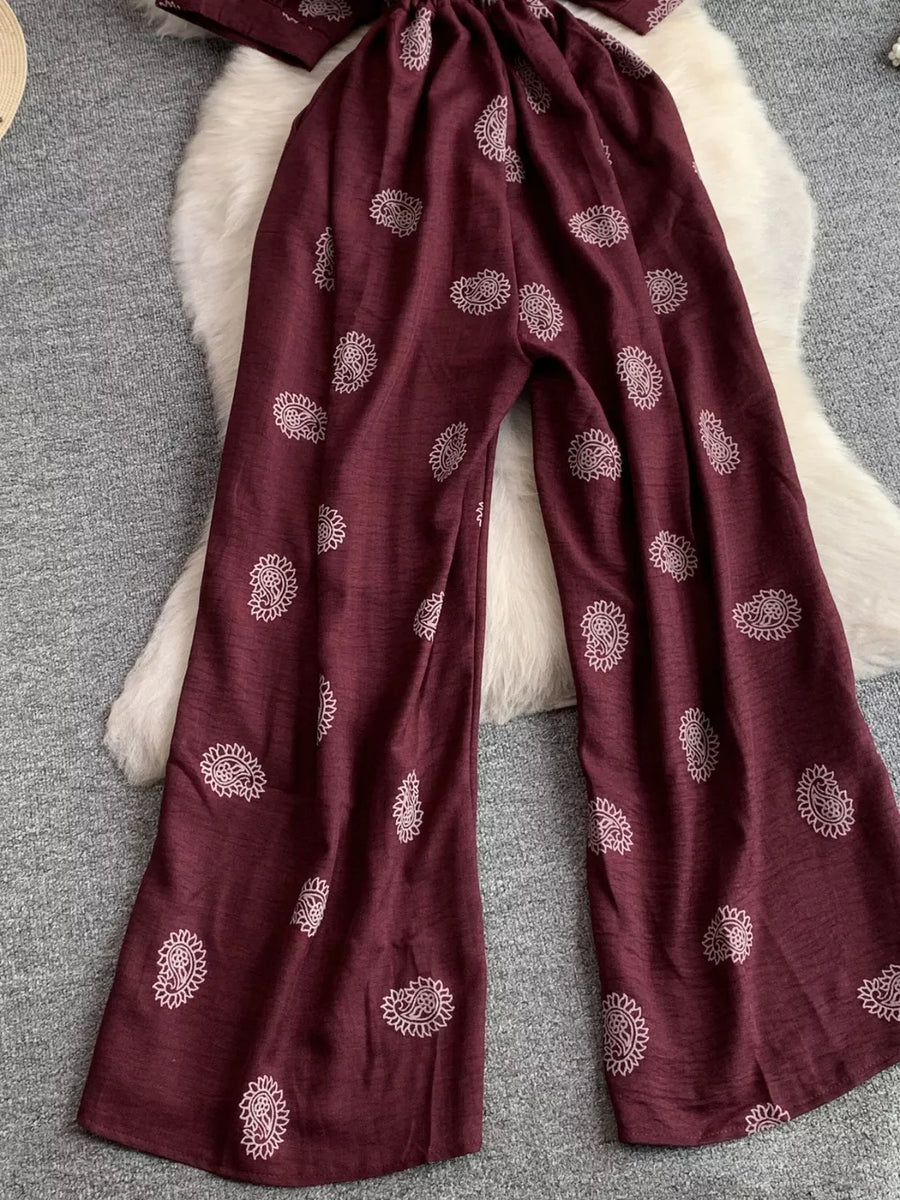 Burgundy paisley print drawstring jumpsuit with wide legs