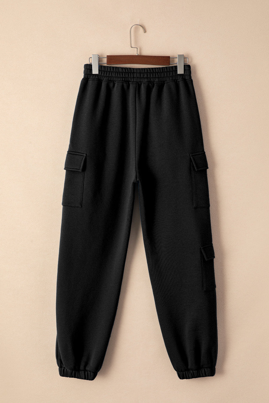 Black cargo pocket joggers with elastic waistband and cuffs.