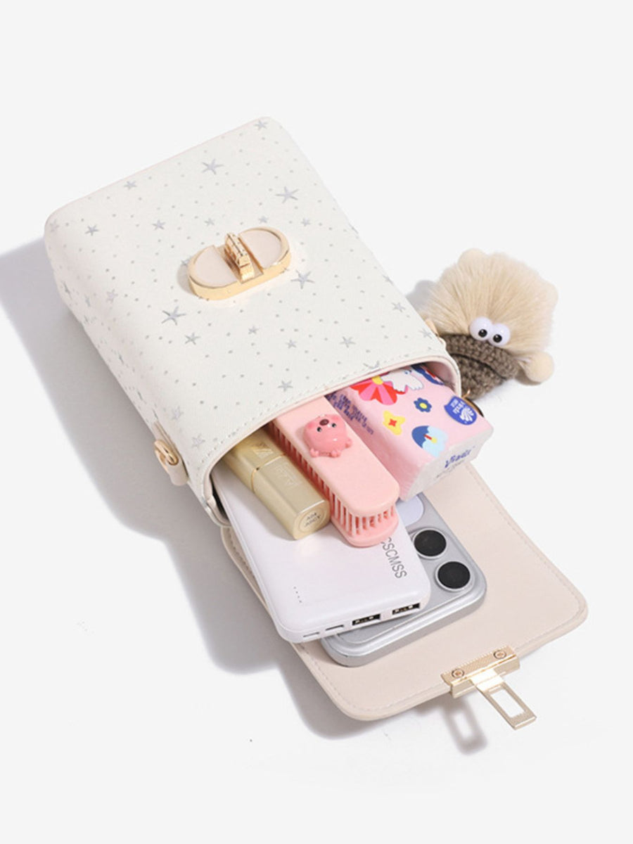 ivory crossbody bag with turn-lock and star-print