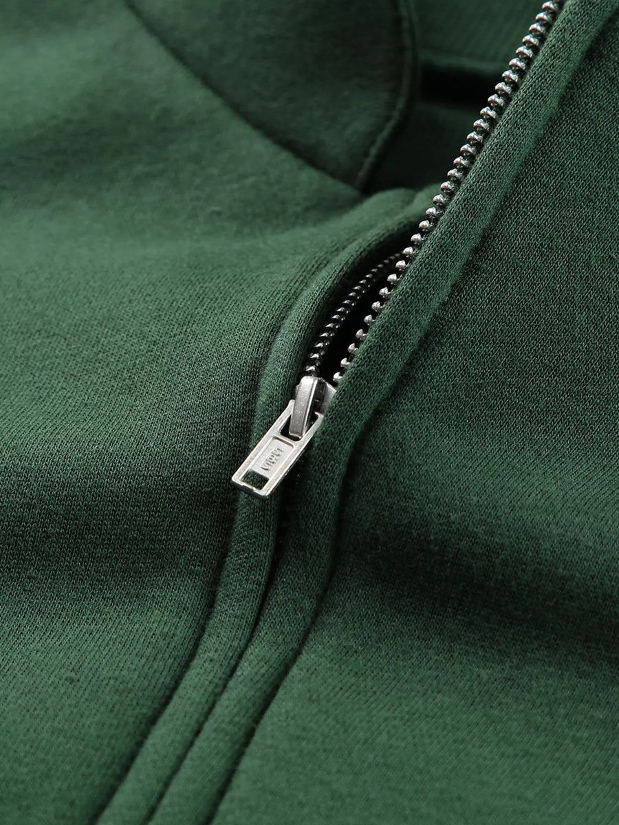 Half zip stand collar sweatshirt in dark green with a silver zipper detail.