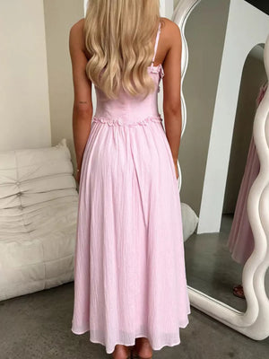 Pink midi dress with spaghetti straps and ruffled details, a-line cut