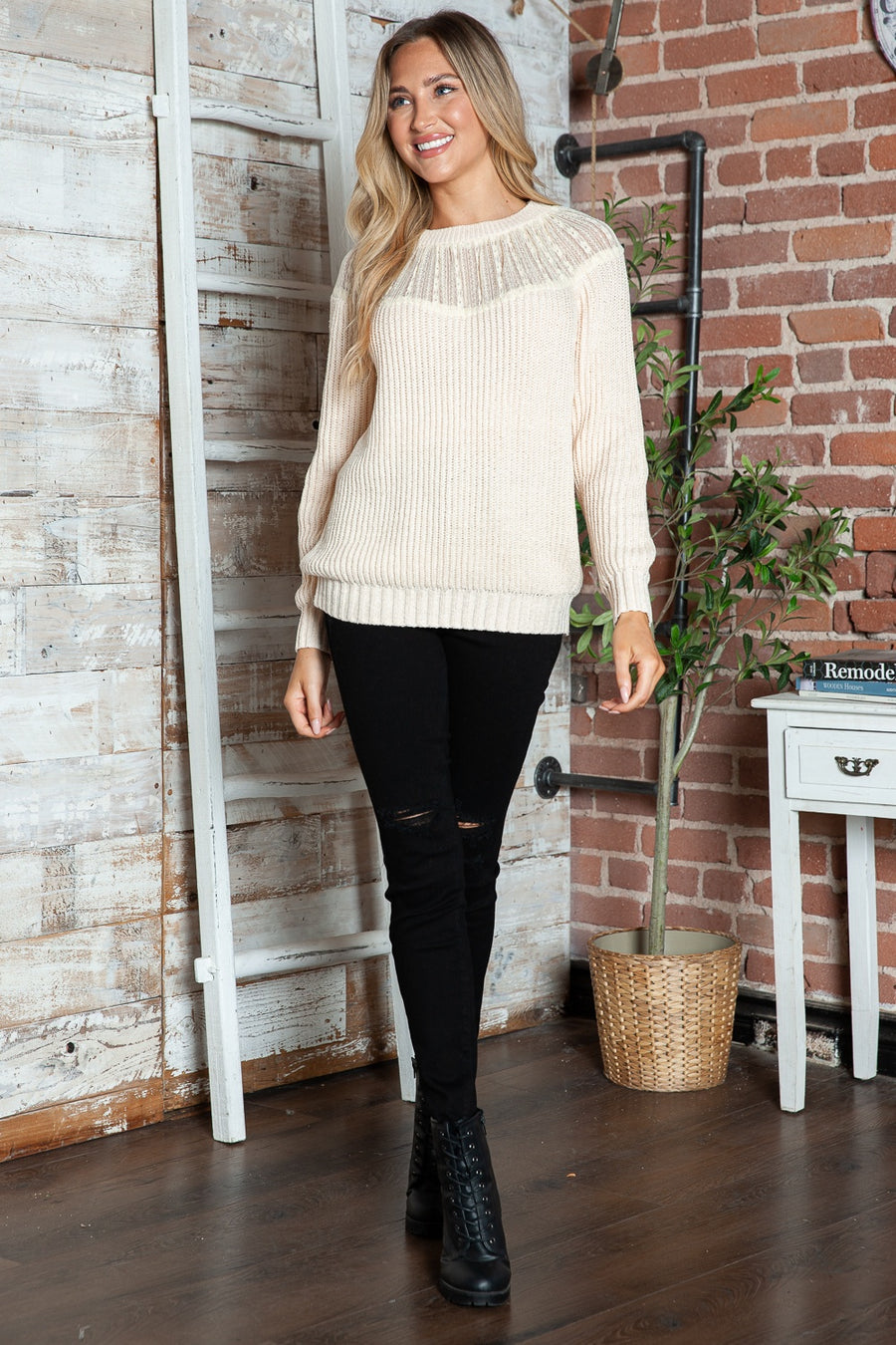 Cream ribbed knit pullover sweater with lace yoke detail and crew neck.