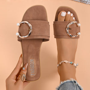 Brown open-toe sandals with pearl-accented buckle detail and embossed "Fashion" text.