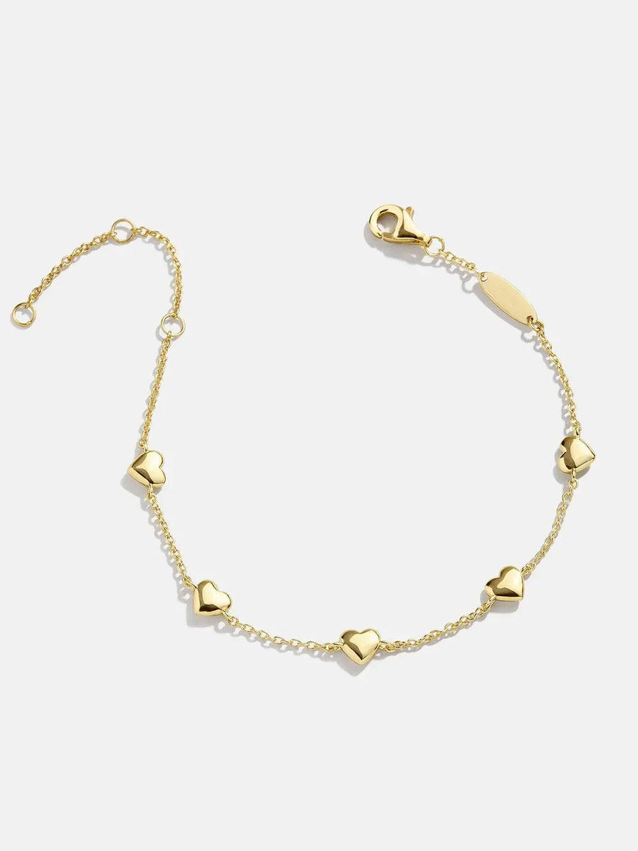 Gold chain bracelet with multiple heart charms