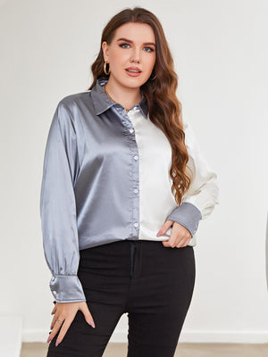 Satin split-tone button-down blouse in light blue and white with button cuffs.
