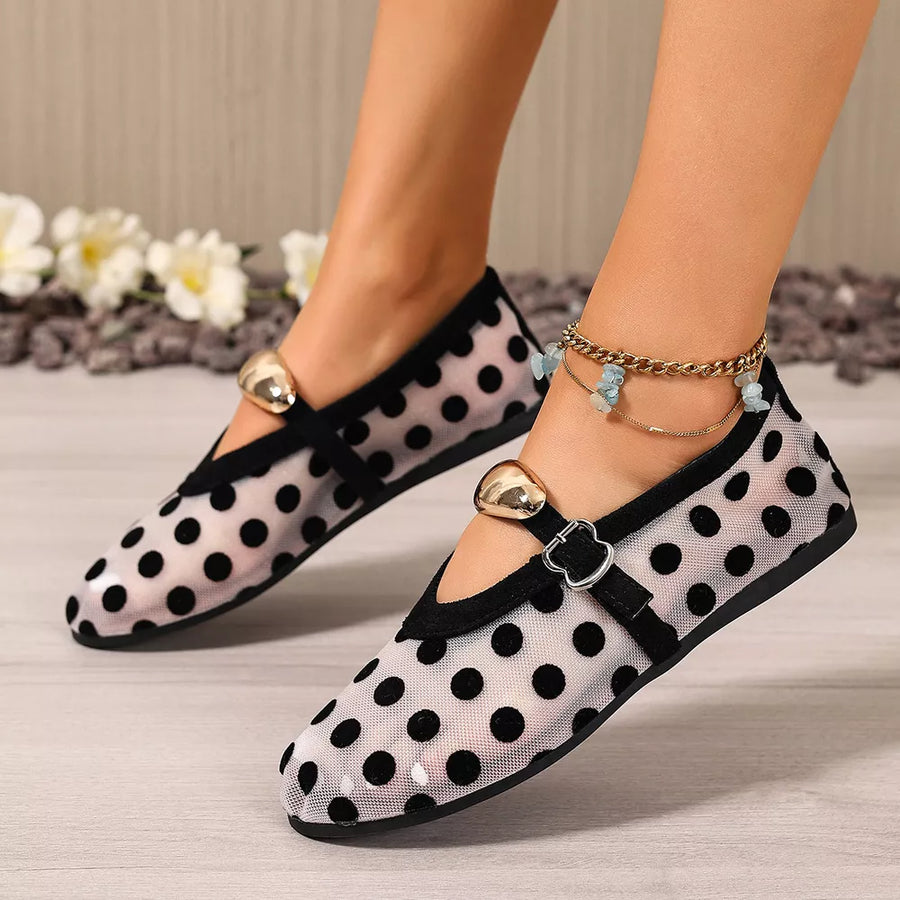black slip-on flats with full-length and buckle