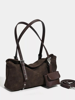 Brown suede medium shoulder bag with adjustable straps and a detachable coin purse.