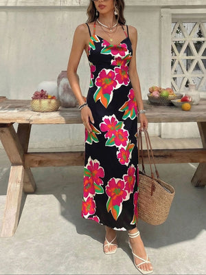 Vibrant floral midi dress with spaghetti straps and cowl neck.