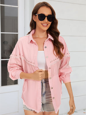 Dusty pink denim trucker jacket with fringe and stud embellishments