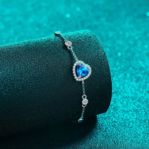 Blue heart halo moissanite bracelet with adjustable chain and sparkling accents.