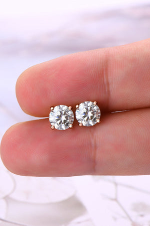Rose gold moissanite solitaire stud earrings with a classic four-prong setting.