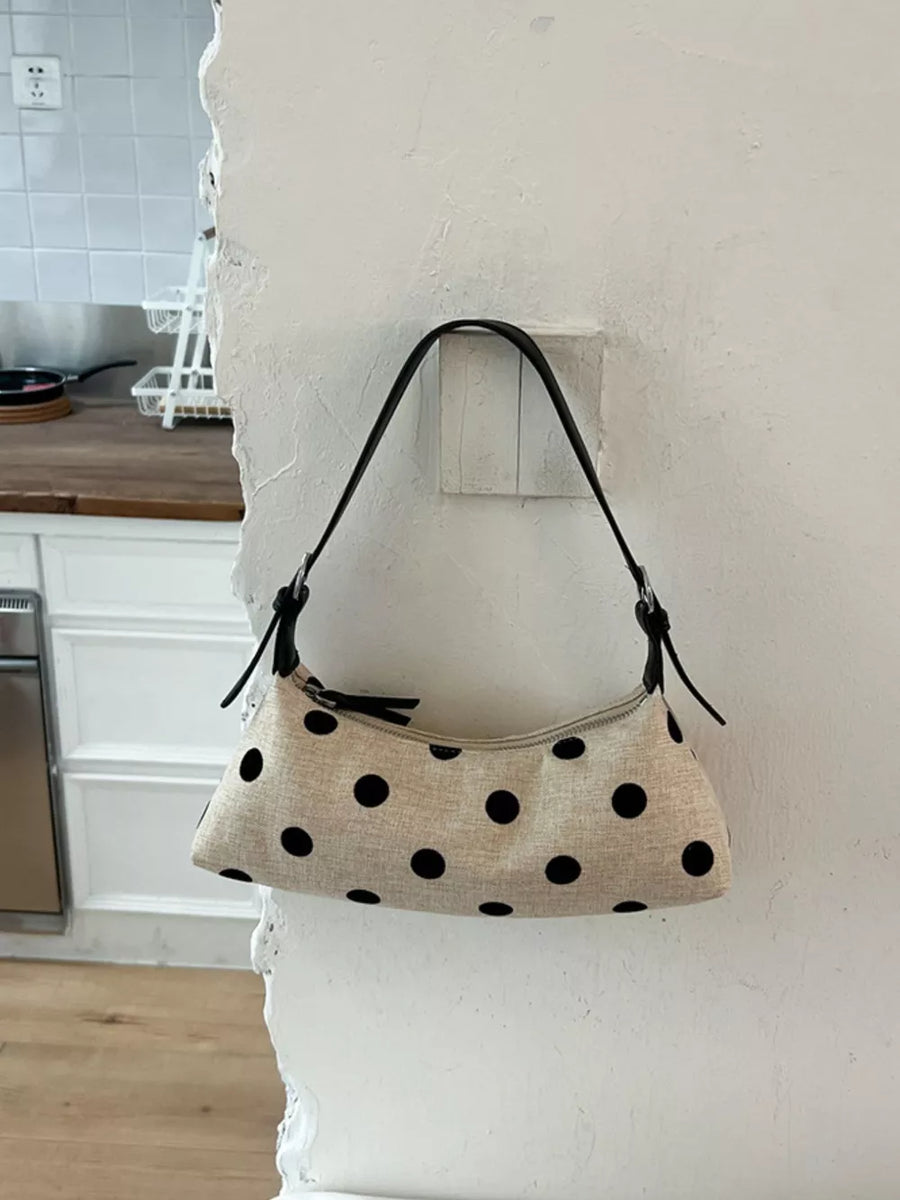 crossbody bag in oatmeal featuring adjustable strap and structured fit