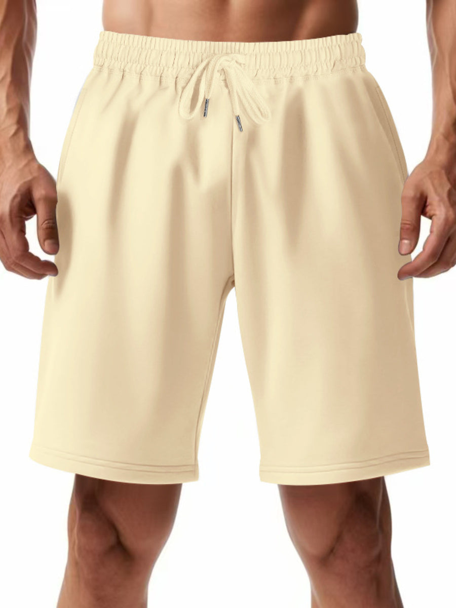 Apricot chino shorts with drawstring waist and elastic waistband.