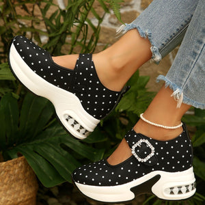 white loafers featuring platform sole and polka dot