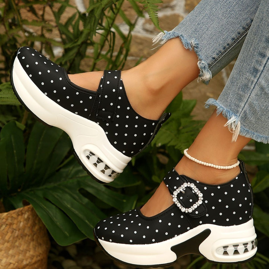 white loafers featuring platform sole and polka dot