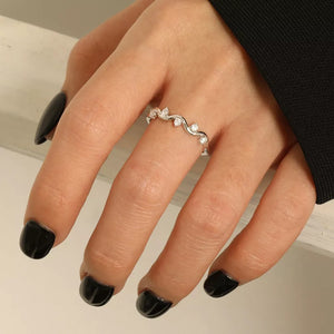 clear ring featuring zircon embellishment and wave