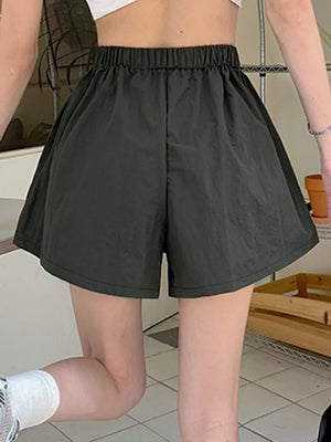 Army green cargo shorts with elastic waistband and adjustable drawstring detail
