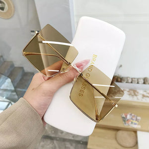 metal Frame material: Metal Lens material: Polycarbonate Temple material: Metal sunglasses in Tan with square silhouette