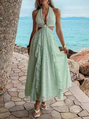 Textured ruffled halter neck maxi dress with cutouts and ring detail in light green.