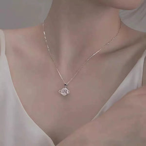 necklace in silver featuring planet pendant and delicate fit