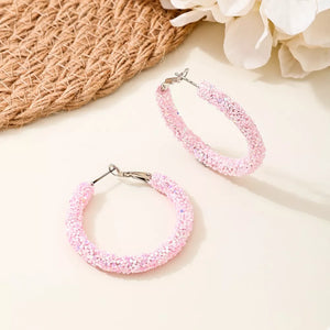 Alloy, Resin, Silver-plated Care instructions: Avoid wearing during exercise, as earrings in Pink with hoop silhouette