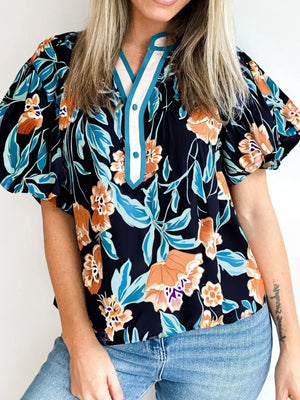 Bubble sleeve buttoned blouse with orange and blue floral print and contrast trim neckline