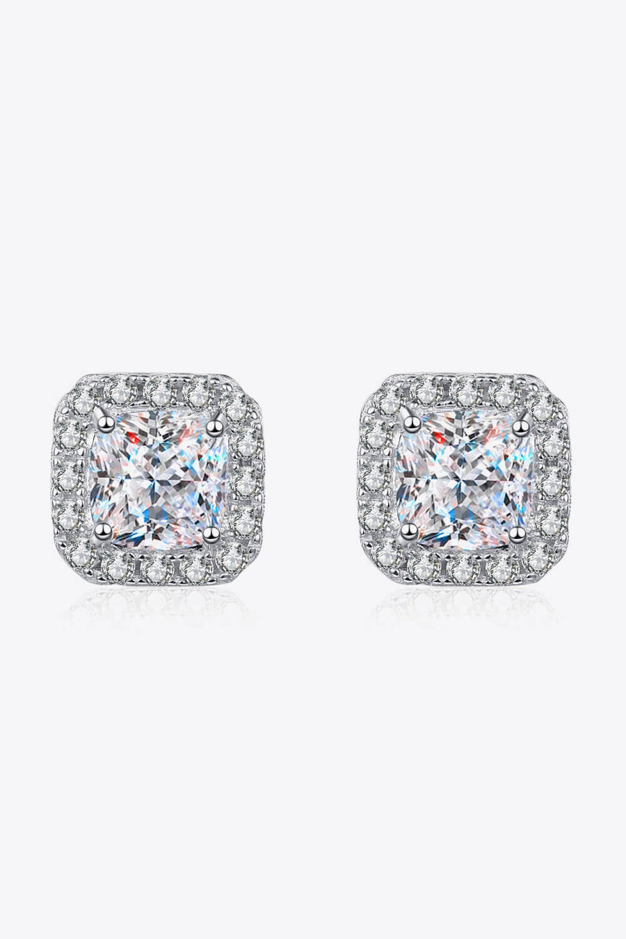 Silver square halo moissanite stud earrings with a cushion-cut center stone.