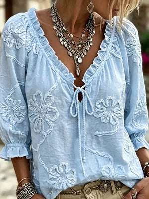 light blue blouse with floral and v-neck