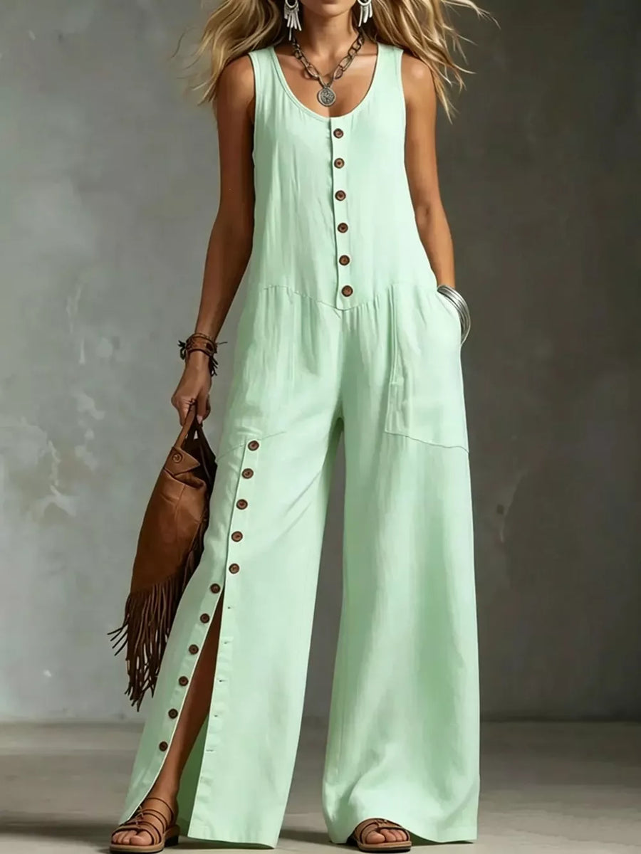 Green button-front wide-leg jumpsuit with side slits and pockets.