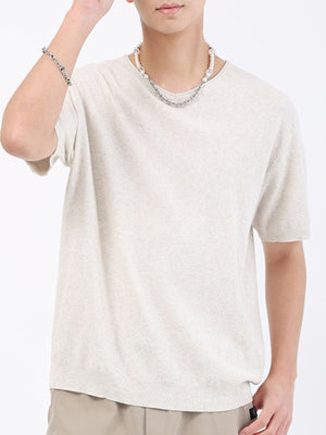 Men's cream casual knit t-shirt with short sleeves and a textured weave.