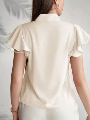 Beige tie-neck blouse with short ruffle sleeves and lace trim.