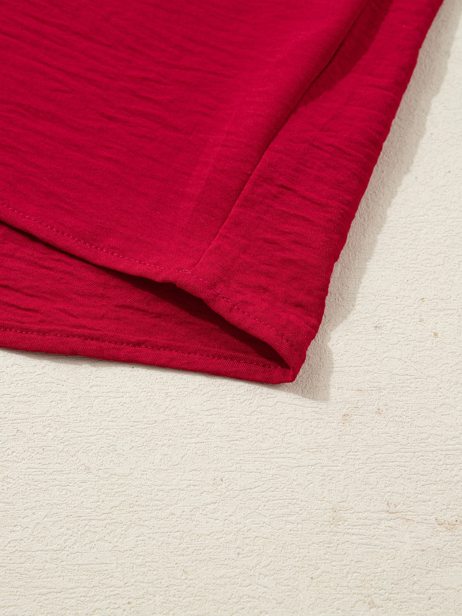 Deep red braided V-neck blouse with textured fabric and half sleeves.