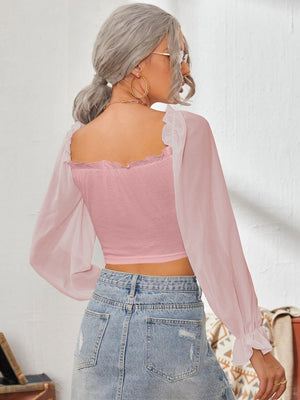 Pink bustier blouse with square neckline and sheer puff sleeves