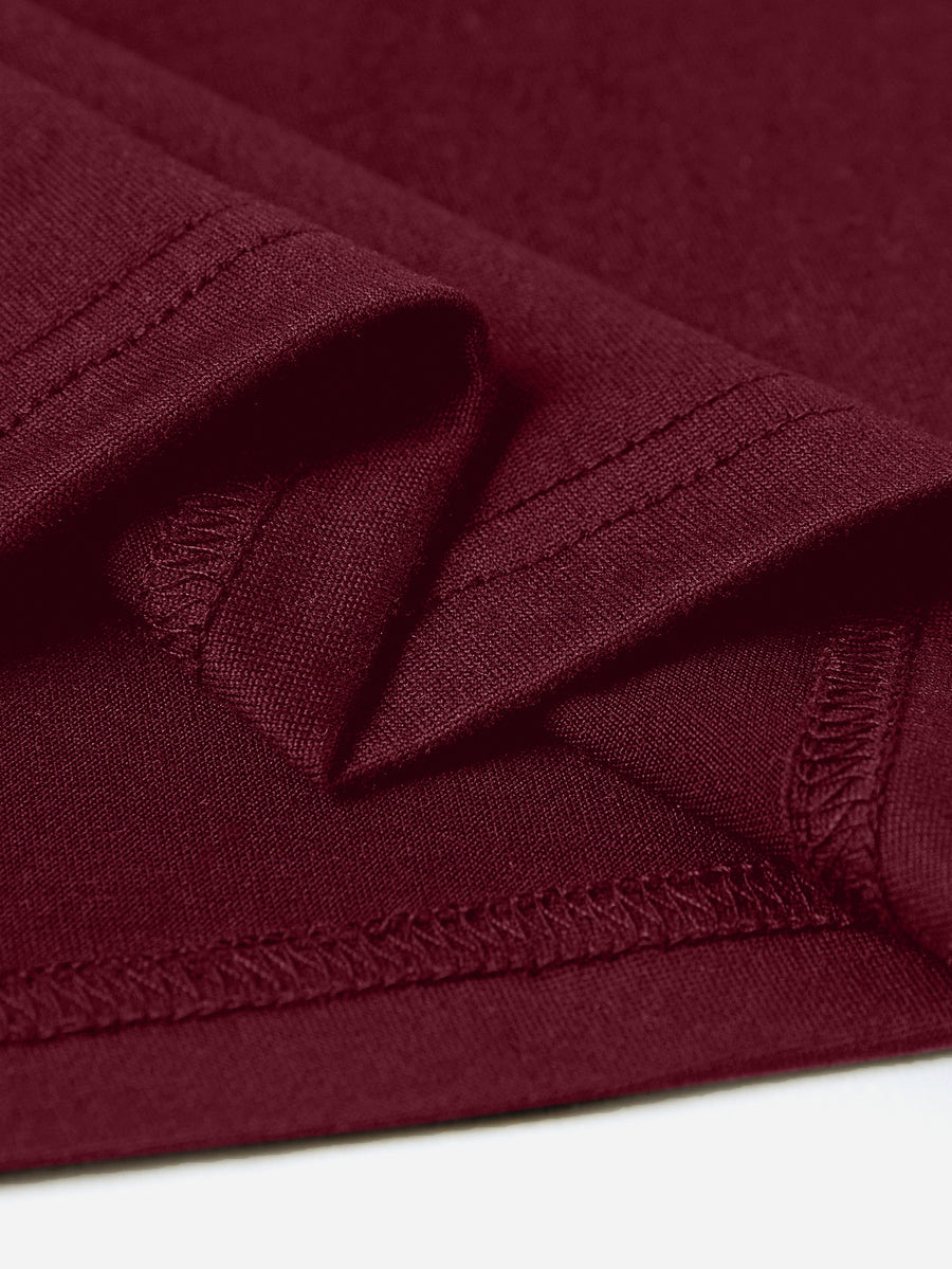 Burgundy maternity t-shirt detail showing hem and stitching.