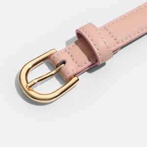 Sleek pink leather belt with luxe golden buckle detail
