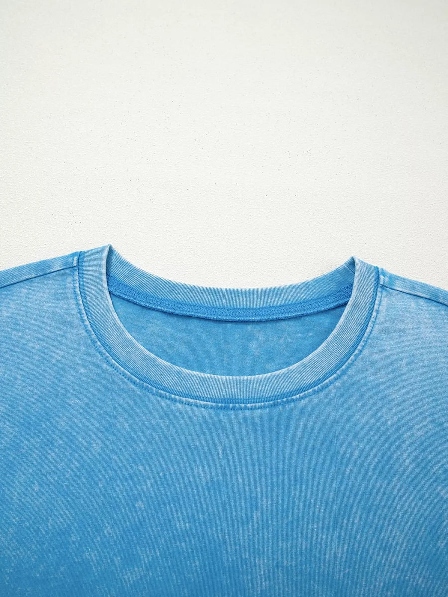 Mineral washed blue cotton crew neck t-shirt with a relaxed fit.