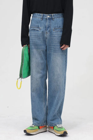 Light blue denim cargo pants with a relaxed fit and unique pocket details.