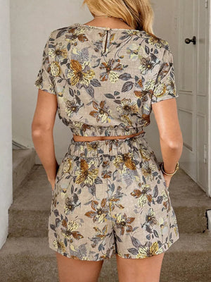 Floral two-piece set with crop top and shorts in tan with brown and yellow flowers, featuring pockets.