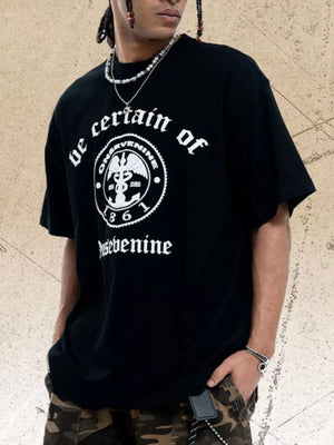 Black oversized graphic t-shirt with white text and emblem detail.