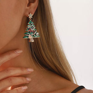 Enchanted Holiday Tree Earrings in green with festive details and a gold star.