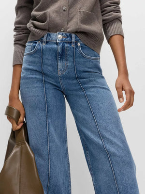 Seam-detail wide leg maternity jeans in blue denim with pockets.