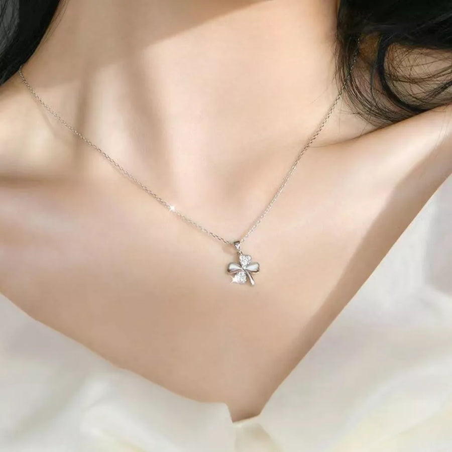 clear necklace featuring clover pendant and novelty