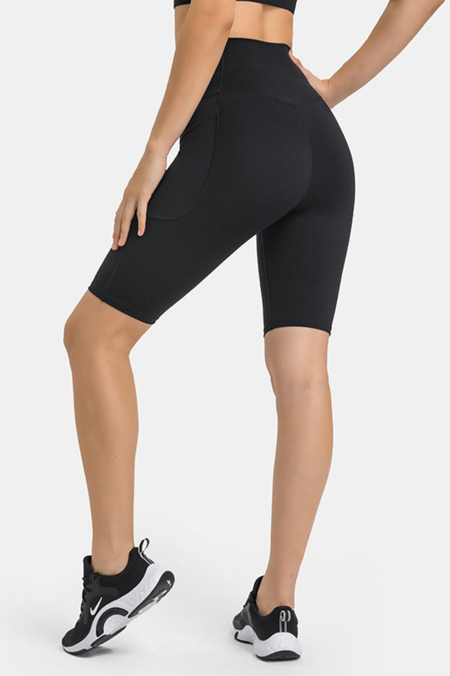 Black V-waist biker shorts with pockets and a V-shaped back seam.