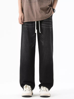 Black gray wide-leg jeans with drawstring and distressed details.