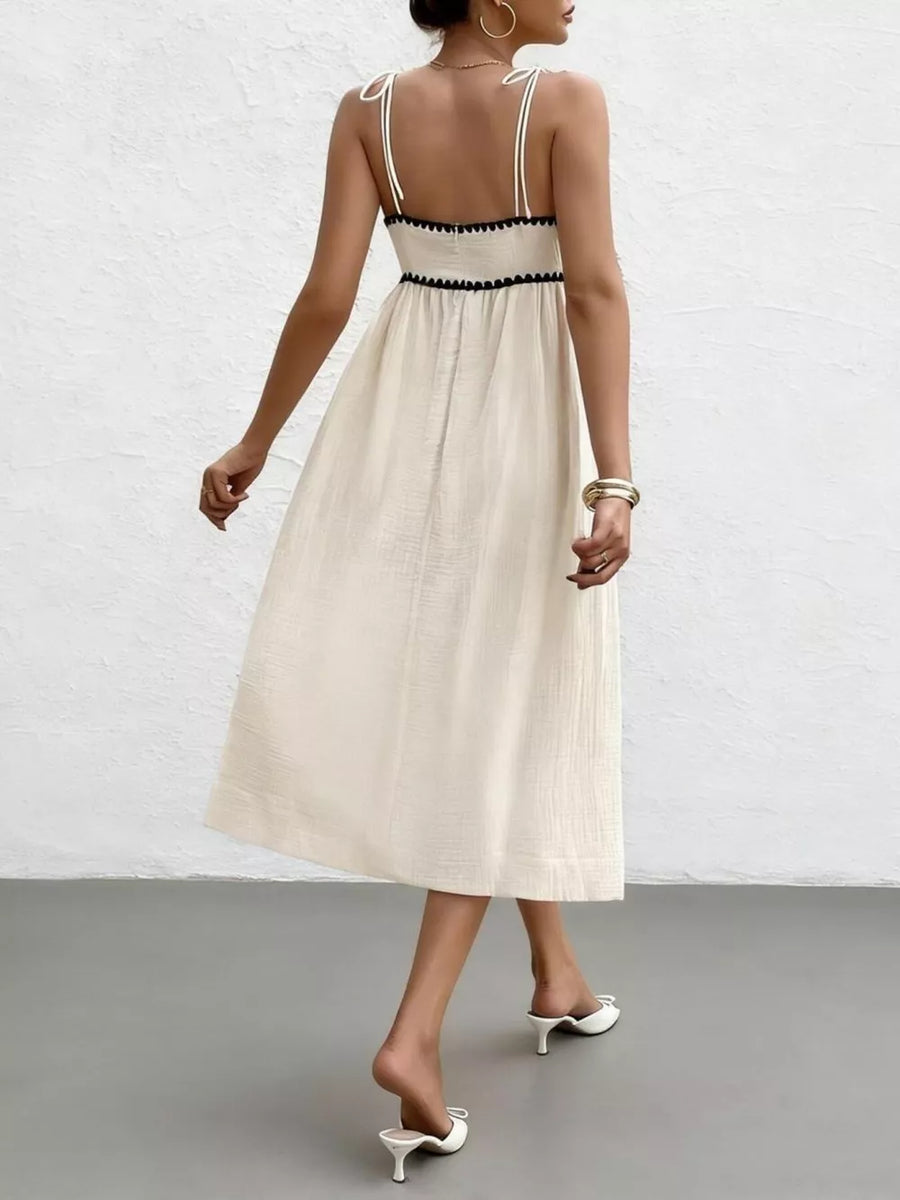 100% polyester Care instructions: Machine wash cold midi dress in cream with A-line silhouette