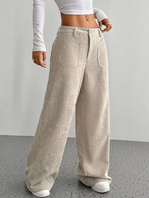 Chic wide-leg corduroy trousers in apricot with large front pockets and a relaxed fit.