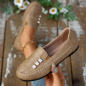 Round Toe Slip-Ons Style 10600196178 in navy blue with decorative stitching